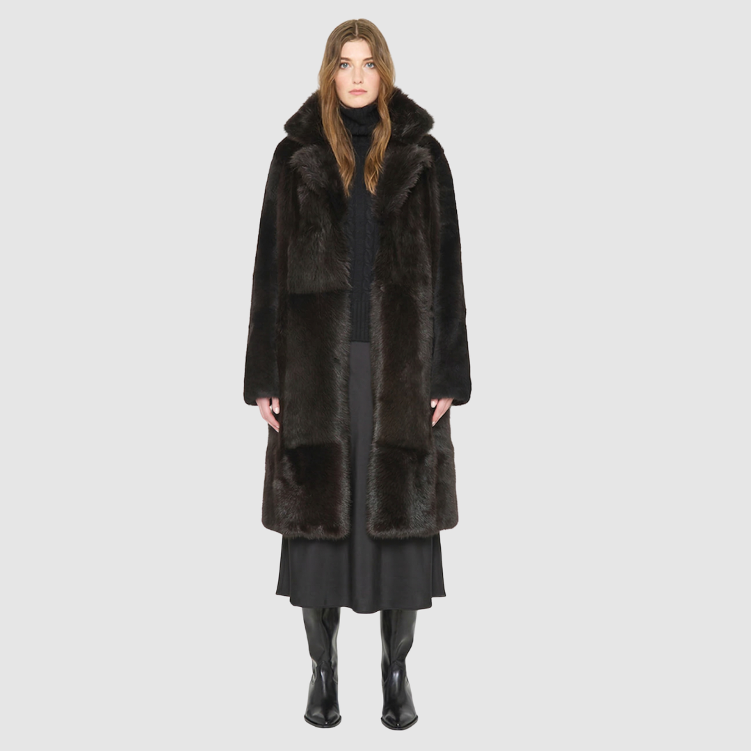 The GRAIL Reversible Shearling Coat offers a modern take on the classic long coat, combining rugged function with luxurious texture. Crafted in a rich suede that reverses to a plush, long-haired wool Toscana shearling, it delivers two distinct looks in one. Designed with a regular shoulder and an oversized notch collar, it balances structure with relaxed ease. Clean tailored panels and versatile integrated pocketing lend utility to this elegant semi-fitted style