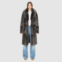 The GRAIL Reversible Shearling Coat offers a modern take on the classic long coat, combining rugged function with luxurious texture. Crafted in a rich nappa that reverses to a plush, long-haired wool Toscana shearling, it delivers two distinct looks in one. Designed with a regular shoulder and an oversized notch collar, it balances structure with relaxed ease. Clean tailored panels and versatile integrated pocketing lend utility to this elegant semi-fitted style