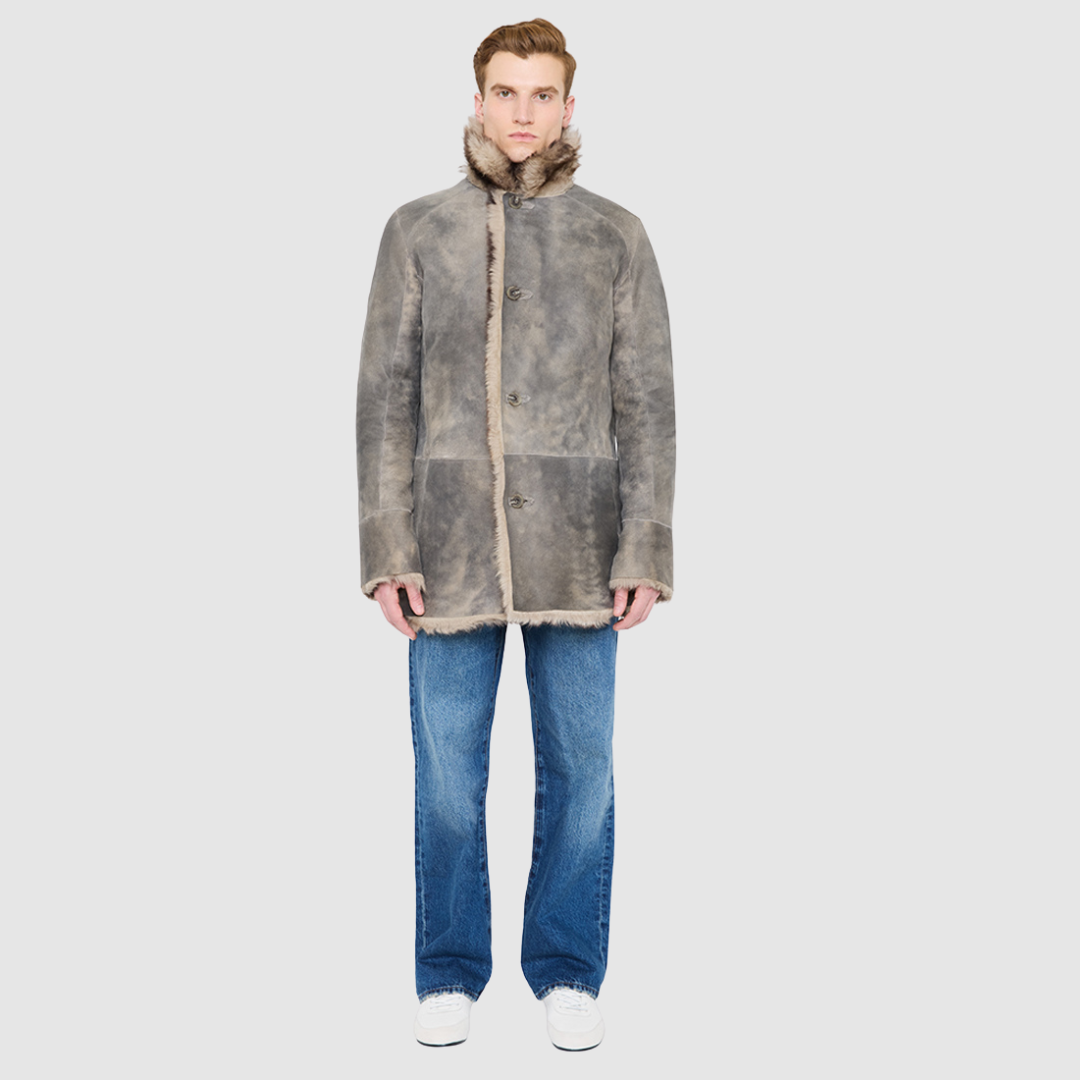 The Josh Opposum Reversible Shearling Jacket embodies modern versatility with heritage-inspired tailoring. Crafted in supple suede and fully reversible to a textured ironed wool teddy, it offers two distinct looks in one. Structured and streamlined when worn wool-in, or relaxed and easy when worn wool-out, this piece adapts effortlessly to changing moods and occasions. Finished with a notch collar, raw edge detailing, and functional slash pockets on both sides, Josh delivers understated luxury