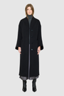 The LEONA Coat is a modern full-length silhouette crafted in a premium black wool blend. Designed with drop shoulders, wide kimono-inspired sleeves, and an easy, relaxed drape, it delivers effortless volume and architectural lines. A clean collarless V-neckline and single-breasted button closure give it a sleek, minimalist finish, while a matching tie belt and elasticized back waist offer versatile styling. Fully lined for comfort, LEONA serves as a definitive statement coat for elevated cold-weather 