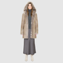 The LOVER reversible shearling jacket offers a modern take on the classic hooded long coat, combining rugged function with luxurious texture. Crafted in a rich smoked quartz suede that reverses to a plush, toscana rasado wool interior, it delivers two distinct looks in one. Designed with a regular shoulder and an oversized shearling hood, it balances structure with relaxed ease. Clean tailored panels and versatile integrated pocketing lend utility to this elegant semi-fitted style