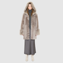 The LOVER reversible shearling jacket offers a modern take on the classic hooded long coat, combining rugged function with luxurious texture. Crafted in a rich smoked quartz suede that reverses to a plush, toscana rasado wool interior, it delivers two distinct looks in one. Designed with a regular shoulder and an oversized shearling hood, it balances structure with relaxed ease. Clean tailored panels and versatile integrated pocketing lend utility to this elegant semi-fitted style