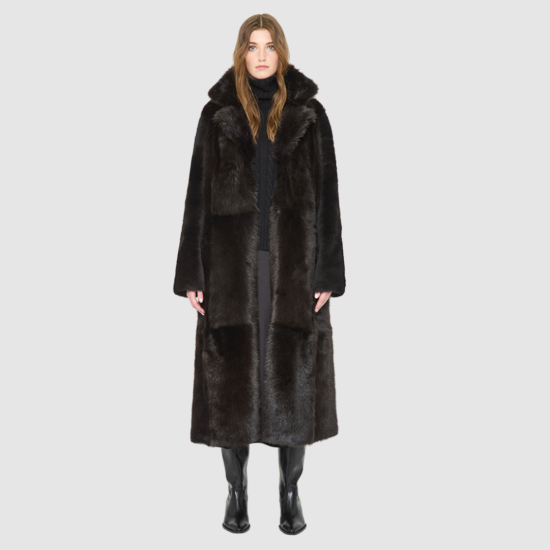 The MAEVE Coat is a heritage-inspired reversible outerwear piece crafted in chocolate&nbsp;suede and Toscana rasado teddy. Designed to flip seamlessly from plush wool-out to sleek suede skin-out, it offers versatile styling for both everyday wear and après-ski sophistication. A drop shoulder provides ease of movement, while the fit adapts—regular when worn wool-out and semi-fitted when worn skin-out. An oversized Toscana wool notch collar and slash pockets on the teddy side