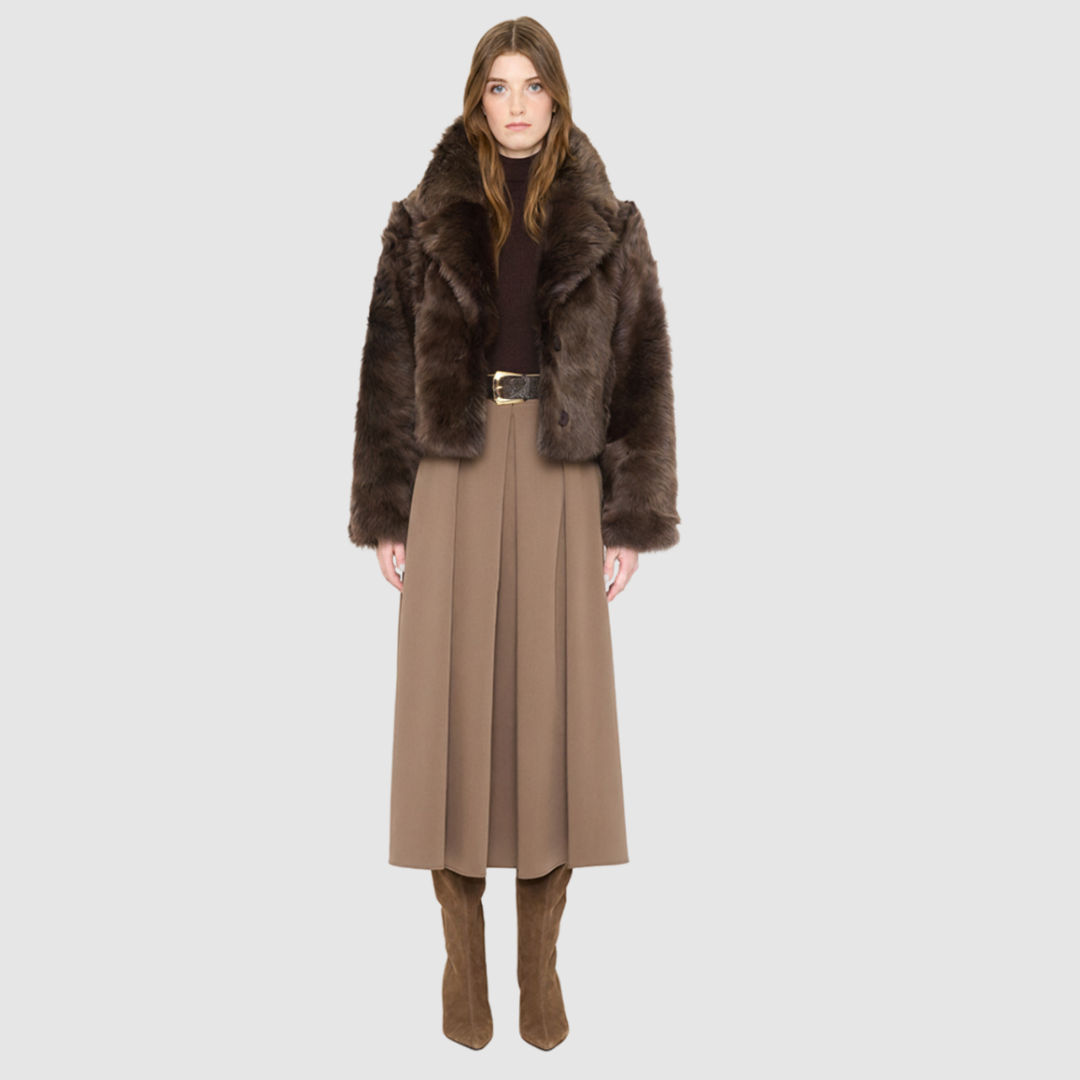The NIKKI teddy Jacket is a modern cropped silhouette crafted in luxurious toscana wool. Designed with a drop shoulder and a relaxed fit through the shoulders, arms, and body, it delivers effortless volume and an easy, natural drape. An oversized toscana notch collar and single-breasted button closure give it a clean, minimalist finish, while slash side pockets add everyday functionality. Fully lined for comfort, NIKKI is the ultimate statement jacket for sophisticated cold-weather layering.