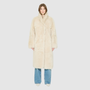 OMEGA introduces an element of understated luxury to cold-weather dressing, offering a longline silhouette engineered for seasonal transition. This exquisite investment outerwear piece pairs a suede exterior skin with a rich, magnificent semi curly toscana wool teddy on the reverse side. Designed to shift seamlessly from a dramatic, texture-forward profile to a classic, minimalist skin-out aesthetic, this fully reversible coat adapts effortlessly to your outfit. 