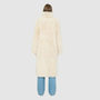 OMEGA introduces an element of understated luxury to cold-weather dressing, offering a longline silhouette engineered for seasonal transition. This exquisite investment outerwear piece pairs a suede exterior skin with a rich, magnificent semi curly toscana wool teddy on the reverse side. Designed to shift seamlessly from a dramatic, texture-forward profile to a classic, minimalist skin-out aesthetic, this fully reversible coat adapts effortlessly to your outfit. 