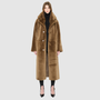 Savvy Craft reversible shearling winter coat on model, featuring oversized collar and button closure in rich brown.