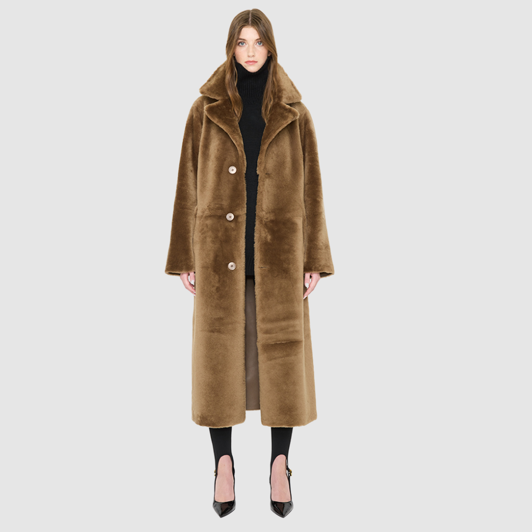 Savvy Craft reversible shearling winter coat on model, featuring oversized collar and button closure in rich brown.