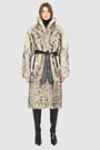 Model wearing the Magic Shadow Shearling Coat, a luxury winter shearling coat with a black leather tie belt.