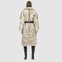 Back view of the Magic Shadow Shearling Coat featuring luxurious curly nodel wool shearling and a stylish leather belt.