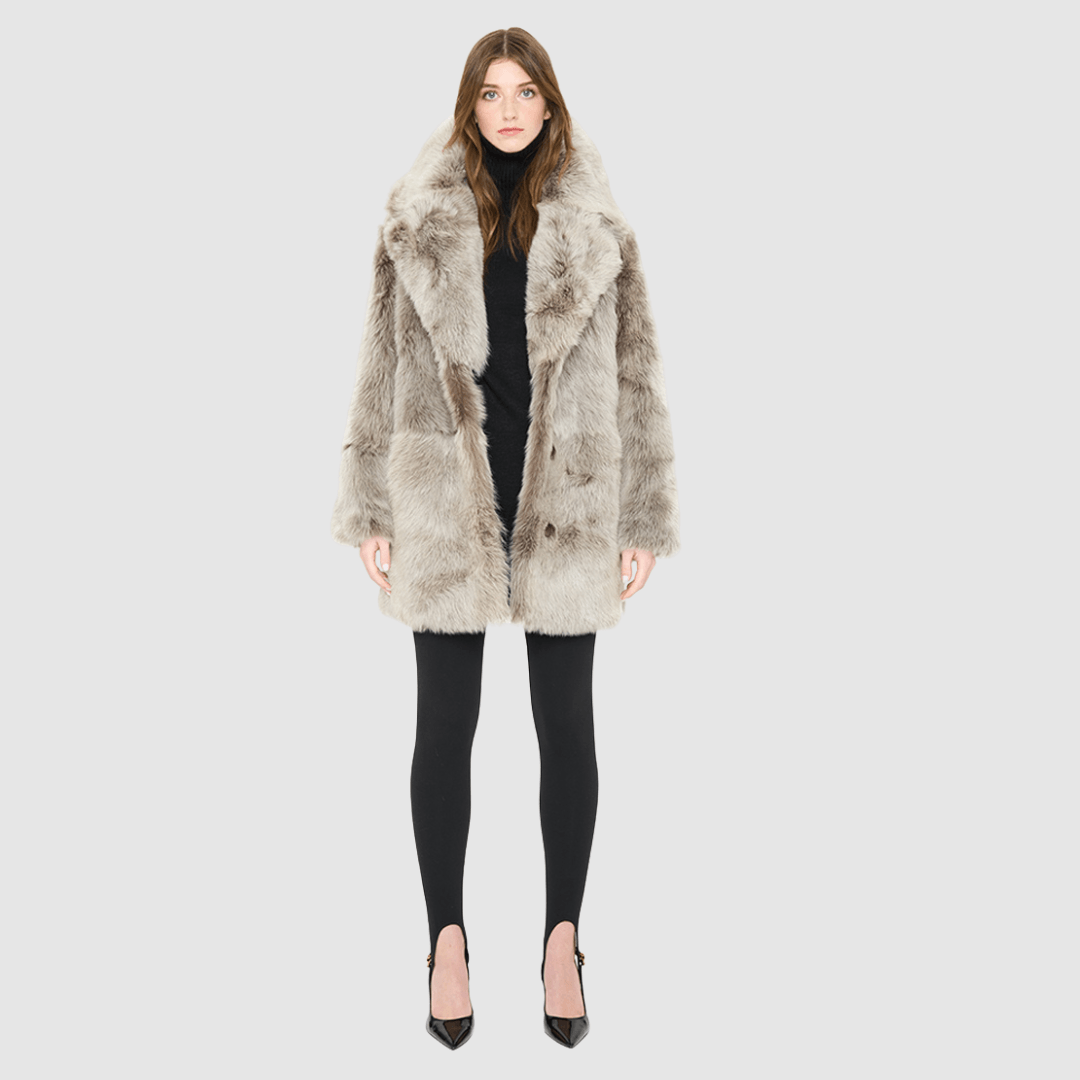 The SIGNI Jacket is a modern oversized silhouette crafted in luxurious toscana wool. Designed with structured shoulders for a defined shape, it delivers effortless volume and architectural style. An oversized Toscana notch collar and single-breasted button closure give it a clean, minimalist finish, while slash side pockets add everyday functionality. Fully lined for comfort, SIGNI is the ultimate statement piece for cold-weather layering.