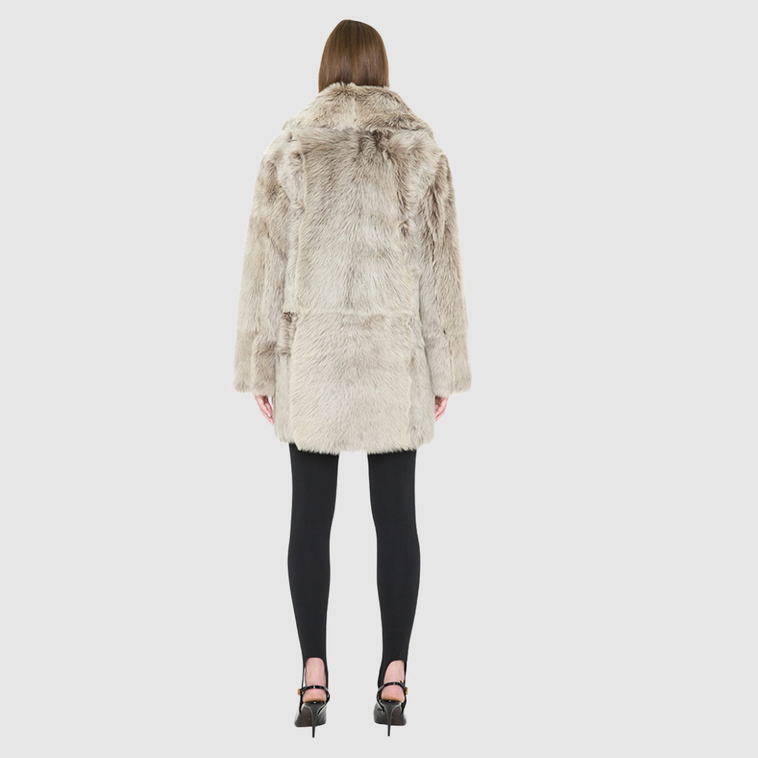 The SIGNI Jacket is a modern oversized silhouette crafted in luxurious toscana wool. Designed with structured shoulders for a defined shape, it delivers effortless volume and architectural style. An oversized Toscana notch collar and single-breasted button closure give it a clean, minimalist finish, while slash side pockets add everyday functionality. Fully lined for comfort, SIGNI is the ultimate statement piece for cold-weather layering.