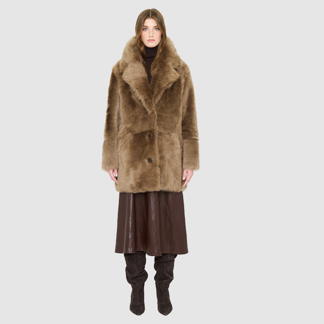 The SIGNI Jacket is a modern oversized silhouette crafted in luxurious toscana wool. Designed with structured shoulders for a defined shape, it delivers effortless volume and architectural style. An oversized Toscana notch collar and single-breasted button closure give it a clean, minimalist finish, while slash side pockets add everyday functionality. Fully lined for comfort, SIGNI is the ultimate statement piece for cold-weather layering.