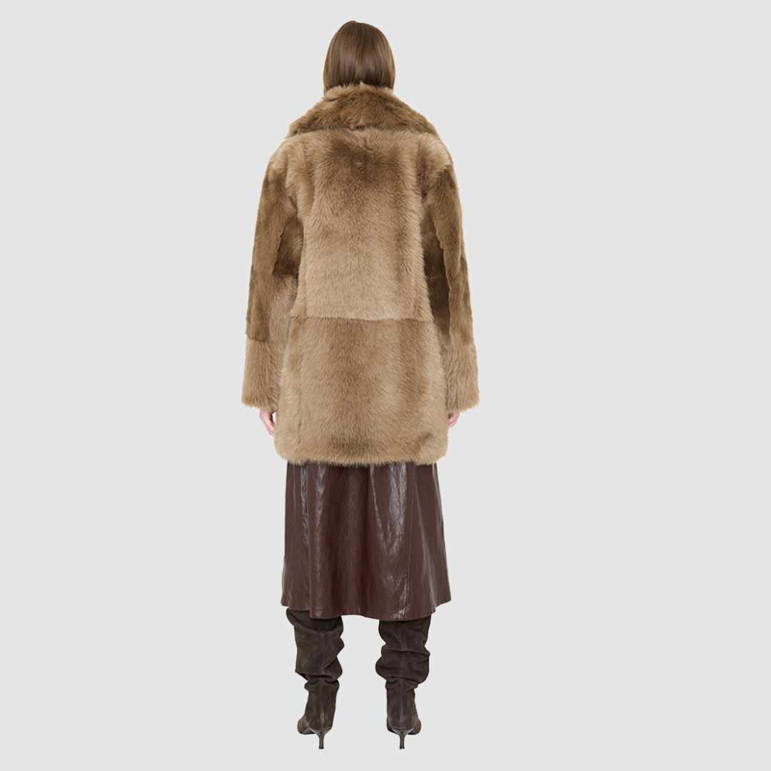 The SIGNI Jacket is a modern oversized silhouette crafted in luxurious toscana wool. Designed with structured shoulders for a defined shape, it delivers effortless volume and architectural style. An oversized Toscana notch collar and single-breasted button closure give it a clean, minimalist finish, while slash side pockets add everyday functionality. Fully lined for comfort, SIGNI is the ultimate statement piece for cold-weather layering.