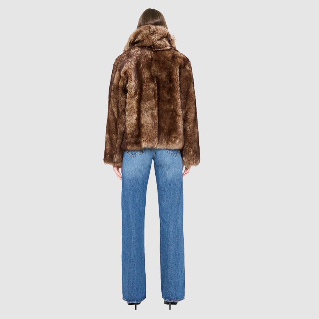 The TOSKA Jacket is a versatile statement piece crafted in burma nappa and toscana shearling. This reversible oversized cropped teddy allows you to switch between a plush teddy texture and a sleek nappa finish for two distinct looks. Designed with a drop-shoulder silhouette and relaxed fit through the shoulders, arms, and body, it combines comfort with elevated style. The oversized Toscana notch collar and functional side pockets complete this luxurious, cold-weather essential.