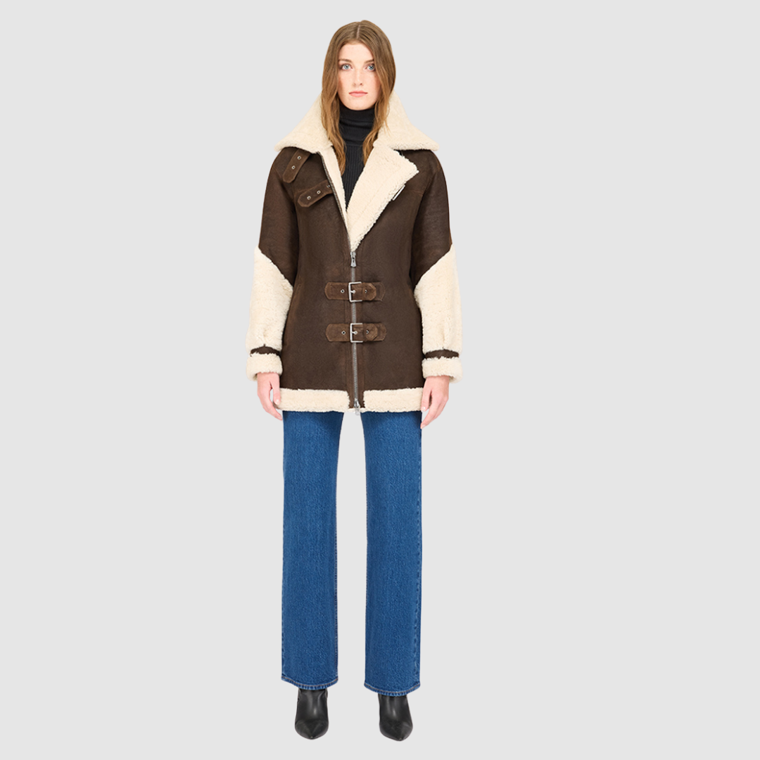 The VITAL arabica Nappa Curly Wool Jacket elevates contemporary moto design with a luxurious mixed-media finish. Crafted from smooth nappa leather and accented with plush curly wool on the collar, sleeves, and trims, it delivers a striking balance of structure and softness. The relaxed silhouette enhances comfort and layering, while signature moto elements—such as the spread collar with buckle detail and asymmetrical zip-and-buckle front closure—infuse the piece with modern edge. 