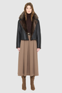 VRILL redefines alpine chic with a sharp, asymmetric profile tailored for effortless seasonal transitions. This cold-weather staple frames the body beautifully, pairing a refined matte nappa leather exterior with a uniform, plush ironed wool interior. Engineered for ultimate versatility across changing climates, the design transitions seamlessly from a classic skin-out moto jacket to a texture-forward statement piece complete with an exaggerated collar.