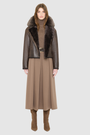 VRILL redefines alpine chic with a sharp, asymmetric profile tailored for effortless seasonal transitions. This cold-weather staple frames the body beautifully, pairing a refined matte nappa leather exterior with a uniform, plush ironed wool interior. Engineered for ultimate versatility across changing climates, the design transitions seamlessly from a classic skin-out moto jacket to a texture-forward statement piece complete with an exaggerated collar.