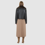 VRILL redefines alpine chic with a sharp, asymmetric profile tailored for effortless seasonal transitions. This cold-weather staple frames the body beautifully, pairing a refined matte nappa leather exterior with a uniform, plush ironed wool interior. Engineered for ultimate versatility across changing climates, the design transitions seamlessly from a classic skin-out moto jacket to a texture-forward statement piece complete with an exaggerated collar.