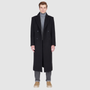 The ATLAS Coat is an elongated double-breasted silhouette crafted from a premium wool blend in an camel melange hue. Designed with structured shoulders and a tailored regular fit through the body, it delivers sharp architectural lines and a refined drape. A wide notch lapel and double-breasted button closure give it a clean, minimalist finish, while discrete side welt pockets and a single back vent add classic functionality. Fully lined for comfort, ATLAS serves as a  statement piece for cold-weather