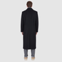 The ATLAS Coat is an elongated double-breasted silhouette crafted from a premium wool blend in an camel melange hue. Designed with structured shoulders and a tailored regular fit through the body, it delivers sharp architectural lines and a refined drape. A wide notch lapel and double-breasted button closure give it a clean, minimalist finish, while discrete side welt pockets and a single back vent add classic functionality. Fully lined for comfort, ATLAS serves as a  statement piece for cold-weather