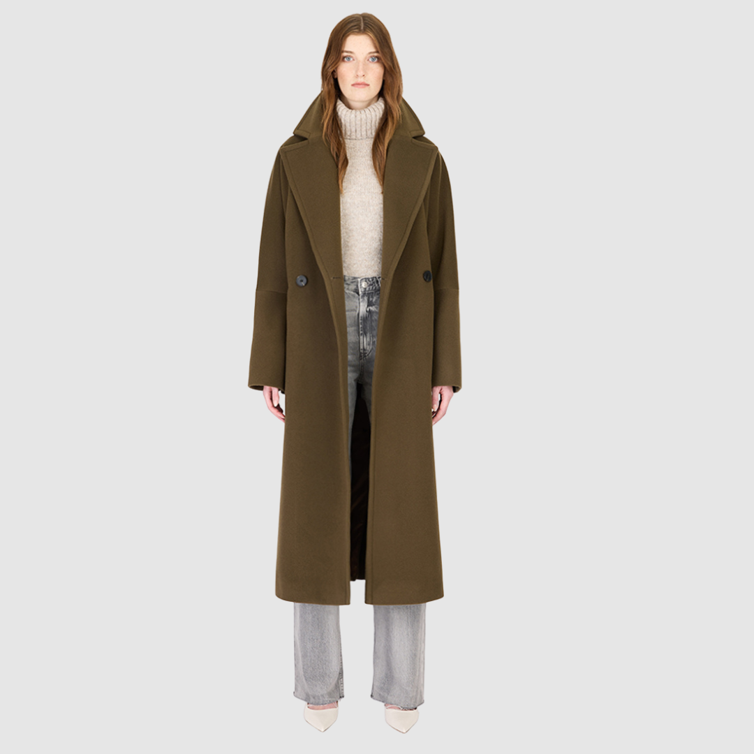 The HARPER Coat is a luxury oversized wool coat crafted from a premium Italian wool-cashmere blend in a rich  tone. Designed with a double-breasted front, drop shoulders, and an oversized fit through the shoulders, arms, and torso, it delivers both comfort and modern edge. A large notch collar and back vent add tailored refinement, while single welt pockets provide everyday functionality. HARPER is the ultimate women’s statement wool coat that blends timeless tailoring with contemporary proportions.