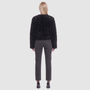The HiSO SORA Jacket is a heritage-inspired cropped shearling jacket, masterfully crafted from premium curly wool shearling for rich texture and dimension. Its regular shoulder and tailored cropped silhouette create a sleek, contemporary fit, while the collarless design and clean edges offer a minimalist, modern aesthetic. Fully lined for exceptional comfort and designed with a hidden hook closure for a seamless finish, the jacket features standard straight sleeves and functional slash side pockets