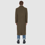 Back view of a man wearing the Atlas Olive Wool Coat, a luxury coat in olive hue, perfect for warm winter layers.