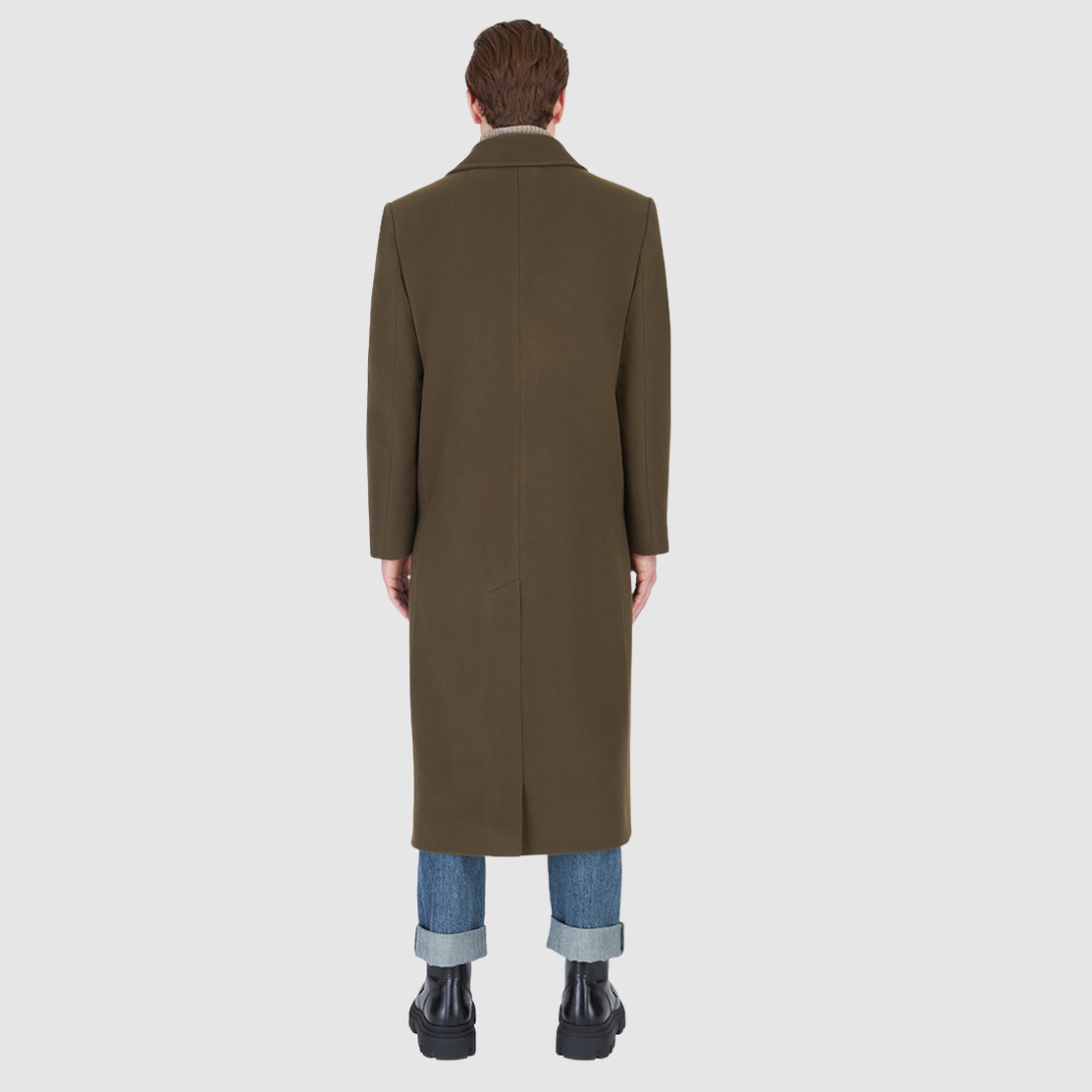 Back view of a man wearing the Atlas Olive Wool Coat, a luxury coat in olive hue, perfect for warm winter layers.