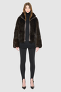 The HOPE Jacket is a versatile statement piece, crafted in chocolate toscana shearling with a modern cropped cut. Designed with a wool-out teddy finish, it reverses to a sleek nappa-out jacket, offering two looks in one. The relaxed shoulder and spread collar create a casual yet elevated silhouette, while slash side pockets add functionality. Finished with a front zip closure, HOPE is the perfect blend of cozy texture and polished edge.