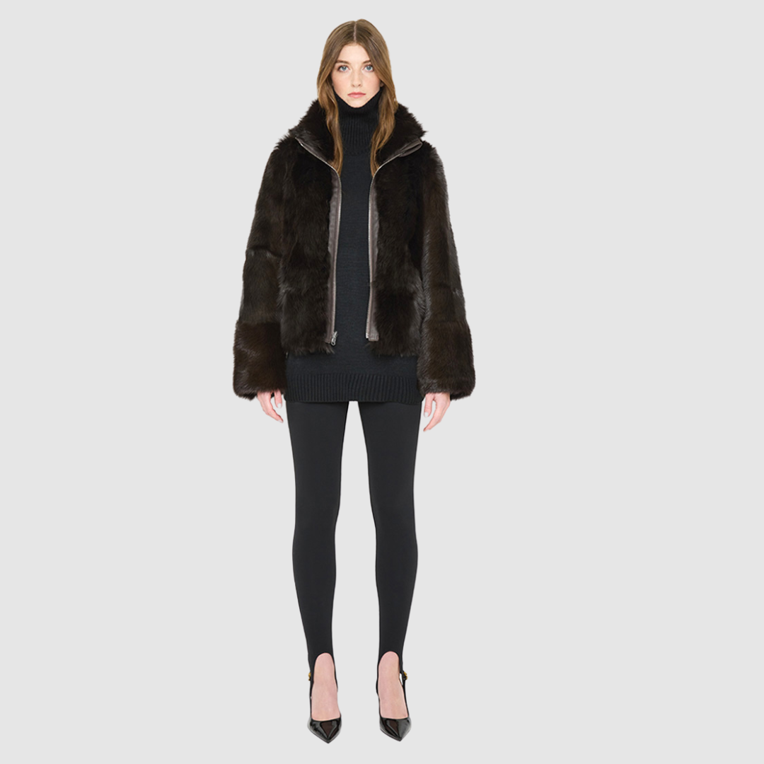 The HOPE Jacket is a versatile statement piece, crafted in chocolate toscana shearling with a modern cropped cut. Designed with a wool-out teddy finish, it reverses to a sleek nappa-out jacket, offering two looks in one. The relaxed shoulder and spread collar create a casual yet elevated silhouette, while slash side pockets add functionality. Finished with a front zip closure, HOPE is the perfect blend of cozy texture and polished edge.