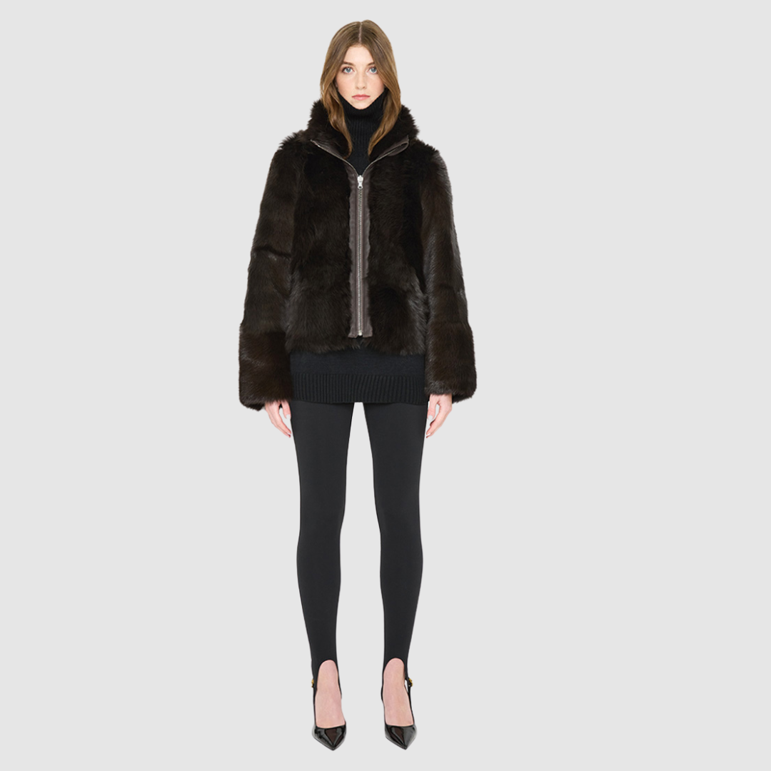 The HOPE Jacket is a versatile statement piece, crafted in chocolate toscana shearling with a modern cropped cut. Designed with a wool-out teddy finish, it reverses to a sleek nappa-out jacket, offering two looks in one. The relaxed shoulder and spread collar create a casual yet elevated silhouette, while slash side pockets add functionality. Finished with a front zip closure, HOPE is the perfect blend of cozy texture and polished edge.