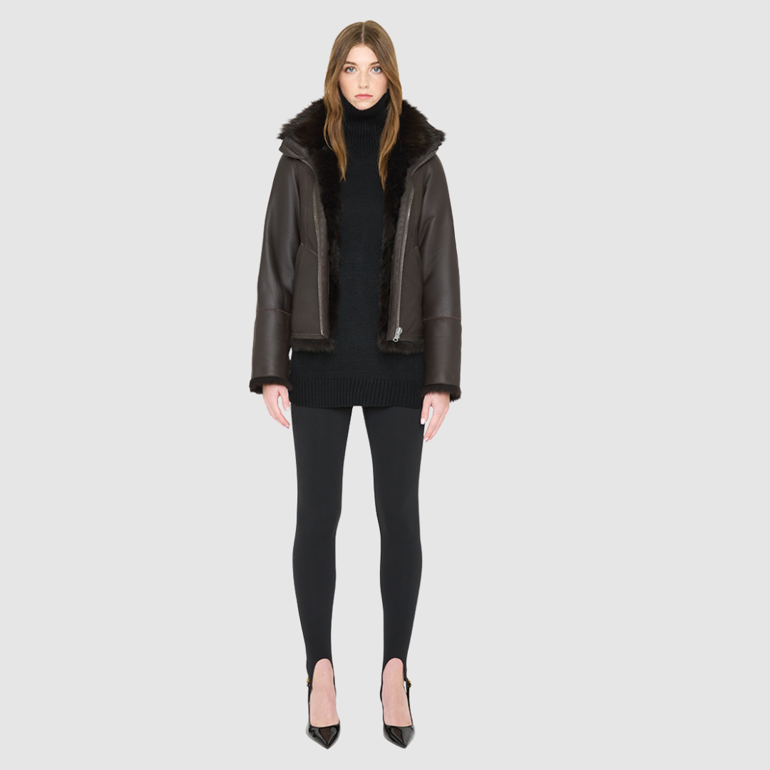 The HOPE Jacket is a versatile statement piece, crafted in chocolate toscana shearling with a modern cropped cut. Designed with a wool-out teddy finish, it reverses to a sleek nappa-out jacket, offering two looks in one. The relaxed shoulder and spread collar create a casual yet elevated silhouette, while slash side pockets add functionality. Finished with a front zip closure, HOPE is the perfect blend of cozy texture and polished edge.