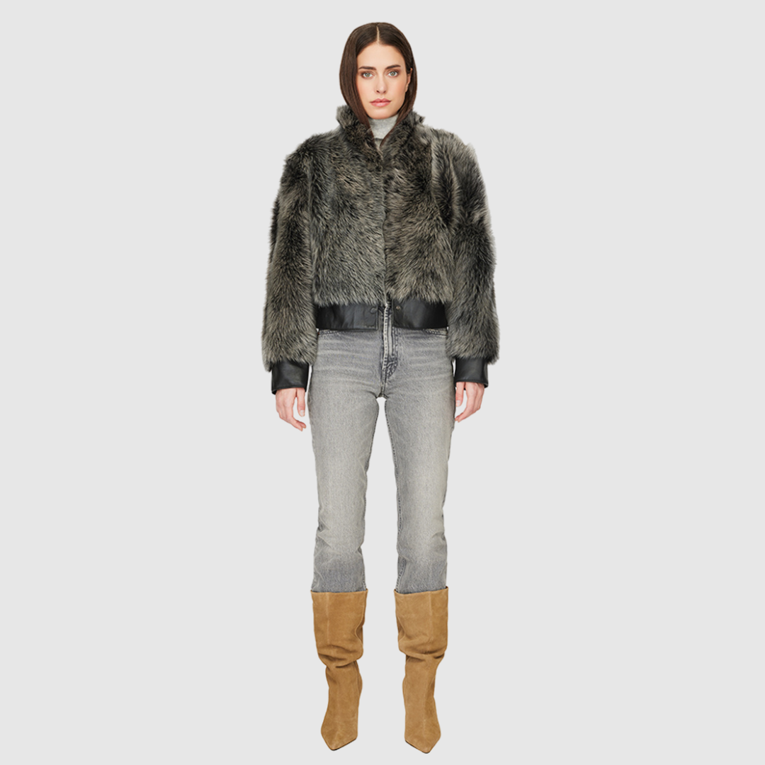 Elevate your outerwear collection with our Women's Cropped Toscana Wool Bomber. Designed for bold style and warmth, this luxe jacket features oversized shoulders and a sleek stand collar for a modern edge. Fully lined for comfort, it offers practical slash side pockets and a secure hook closure. Perfect for chilly days, this statement bomber blends fashion and function, making it an essential addition to any winter wardrobe.
