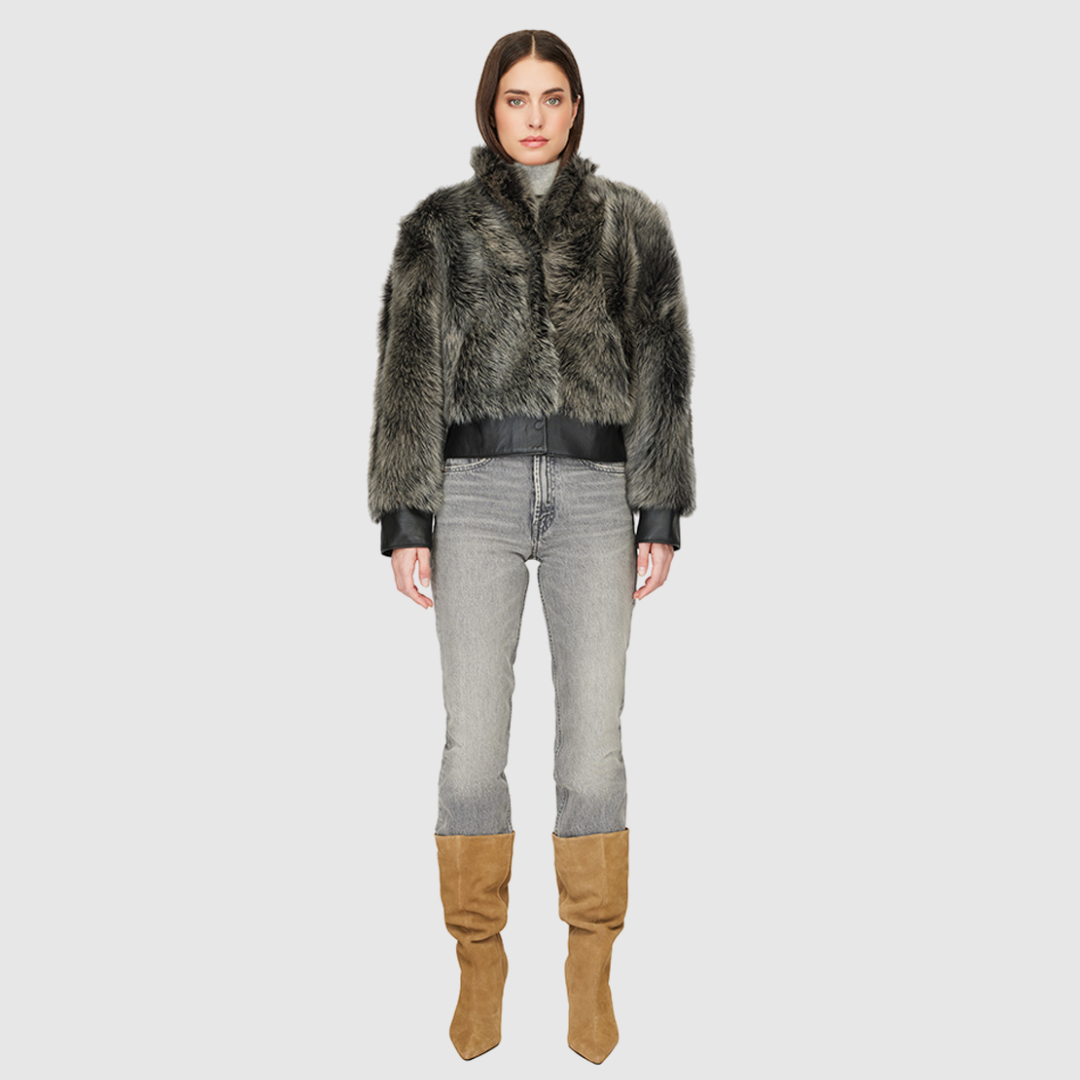 Elevate your outerwear collection with our Women's Cropped Toscana Wool Bomber. Designed for bold style and warmth, this luxe jacket features oversized shoulders and a sleek stand collar for a modern edge. Fully lined for comfort, it offers practical slash side pockets and a secure hook closure. Perfect for chilly days, this statement bomber blends fashion and function, making it an essential addition to any winter wardrobe.
