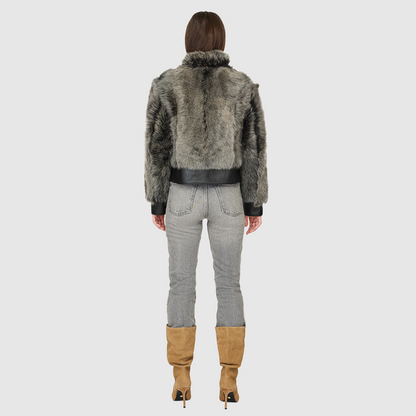 Elevate your outerwear collection with our Women's Cropped Toscana Wool Bomber. Designed for bold style and warmth, this luxe jacket features oversized shoulders and a sleek stand collar for a modern edge. Fully lined for comfort, it offers practical slash side pockets and a secure hook closure. Perfect for chilly days, this statement bomber blends fashion and function, making it an essential addition to any winter wardrobe.
