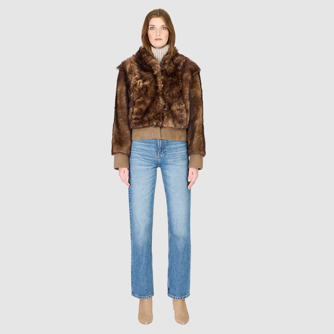 The BEAN Bomber Jacket is a modern cropped silhouette crafted in luxurious toscana wool. Designed with oversized shoulders for a relaxed fit, it delivers effortless volume and style. A stand collar and hook closure give it a clean, minimalist finish, while slash side pockets add everyday functionality. Fully lined for comfort, BEAN is the ultimate statement bomber for cold-weather layering.