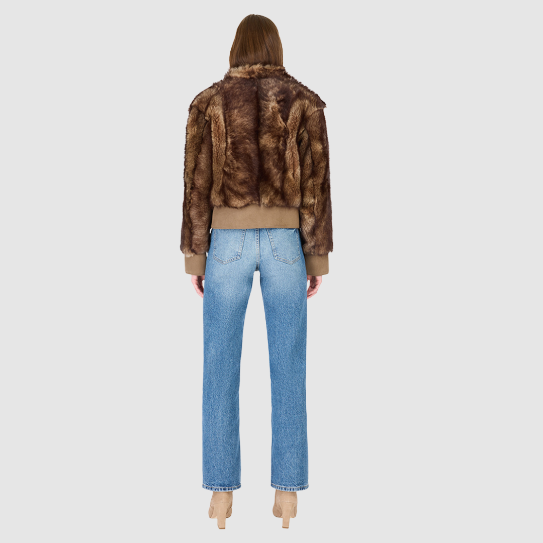 The BEAN Bomber Jacket is a modern cropped silhouette crafted in luxurious toscana wool. Designed with oversized shoulders for a relaxed fit, it delivers effortless volume and style. A stand collar and hook closure give it a clean, minimalist finish, while slash side pockets add everyday functionality. Fully lined for comfort, BEAN is the ultimate statement bomber for cold-weather layering.