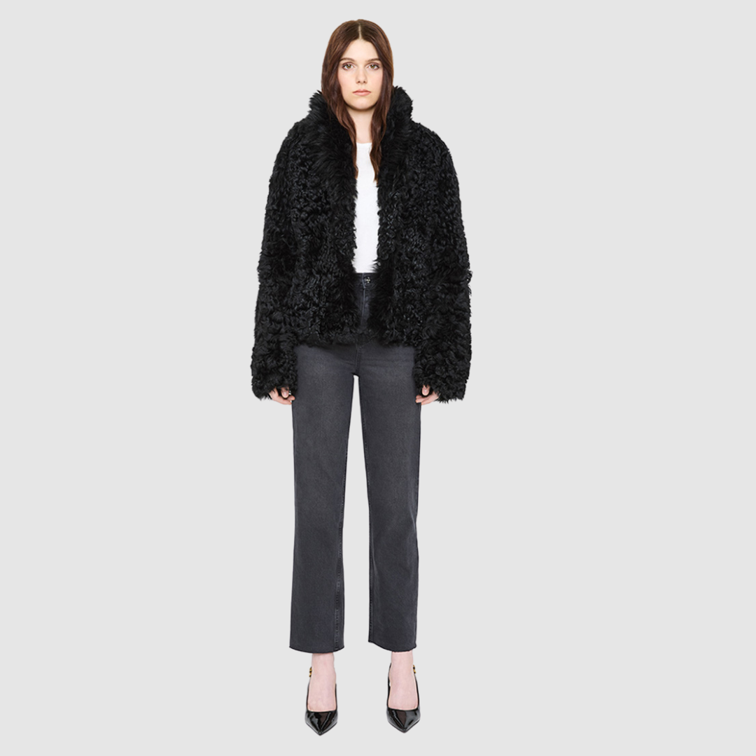 The HiSO CUPID Jacket is a heritage-inspired mid-length shearling jacket, masterfully crafted from premium semi-curly shearling wool for rich texture and dimension. Its regular shoulder and relaxed mid-length silhouette create a sleek, contemporary fit, while the dramatic, oversized stand collar offers an elevated, modern aesthetic. Designed with a versatile, reversible layout, this statement piece offers two distinctive looks in one