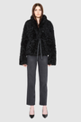 The HiSO CUPID Jacket is a heritage-inspired mid-length shearling jacket, masterfully crafted from premium semi-curly shearling wool for rich texture and dimension. Its regular shoulder and relaxed mid-length silhouette create a sleek, contemporary fit, while the dramatic, oversized stand collar offers an elevated, modern aesthetic. Designed with a versatile, reversible layout, this statement piece offers two distinctive looks in one