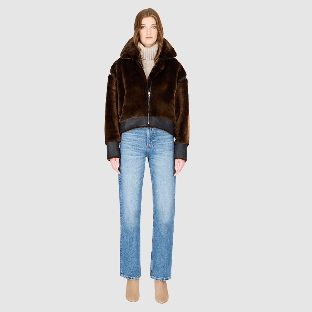 The GAIA macassar jacket is a bold, versatile outerwear piece designed in a iron wool and nappa combination. This reversible oversized cropped jacket offers two distinct looks in one, effortlessly blending texture and edge. Its drop-shoulder silhouette creates a relaxed, contemporary fit, while the tapered hem adds subtle shaping. Functional side and interior zip pockets and a standard front zip closure complete this statement jacket, perfect for layering in style.