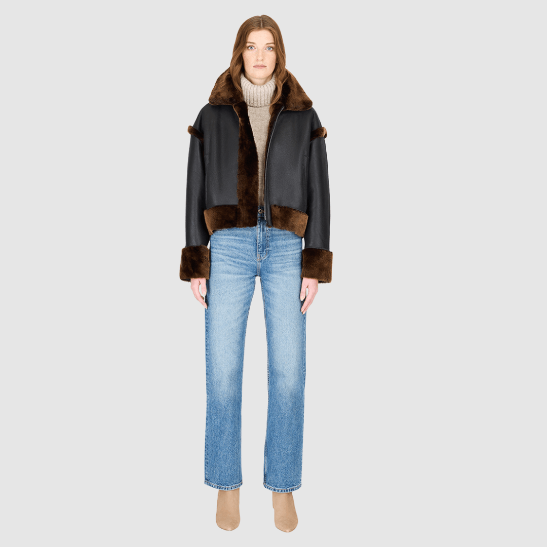 The GAIA macassar jacket is a bold, versatile outerwear piece designed in a iron wool and nappa combination. This reversible oversized cropped jacket offers two distinct looks in one, effortlessly blending texture and edge. Its drop-shoulder silhouette creates a relaxed, contemporary fit, while the tapered hem adds subtle shaping. Functional side and interior zip pockets and a standard front zip closure complete this statement jacket, perfect for layering in style.