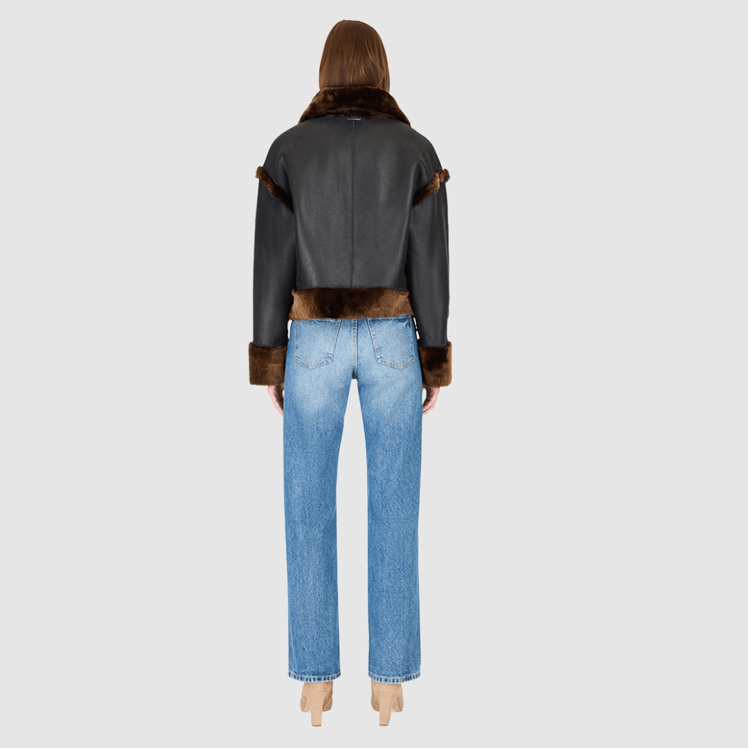 The GAIA macassar jacket is a bold, versatile outerwear piece designed in a iron wool and nappa combination. This reversible oversized cropped jacket offers two distinct looks in one, effortlessly blending texture and edge. Its drop-shoulder silhouette creates a relaxed, contemporary fit, while the tapered hem adds subtle shaping. Functional side and interior zip pockets and a standard front zip closure complete this statement jacket, perfect for layering in style.