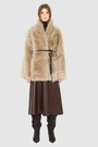 The HiSO GLO Jacket is a heritage-inspired mid-length shearling coat, masterfully crafted from premium semi curly toscana shearling for unparalleled texture and depth. Its regular shoulder and relaxed mid-length silhouette create an elegant, contemporary fit, while the dramatic, shawl collar frames the face with plush, long-haired wool. Designed with a versatile, reversible construction, this statement coat provides two distinctive looks in one