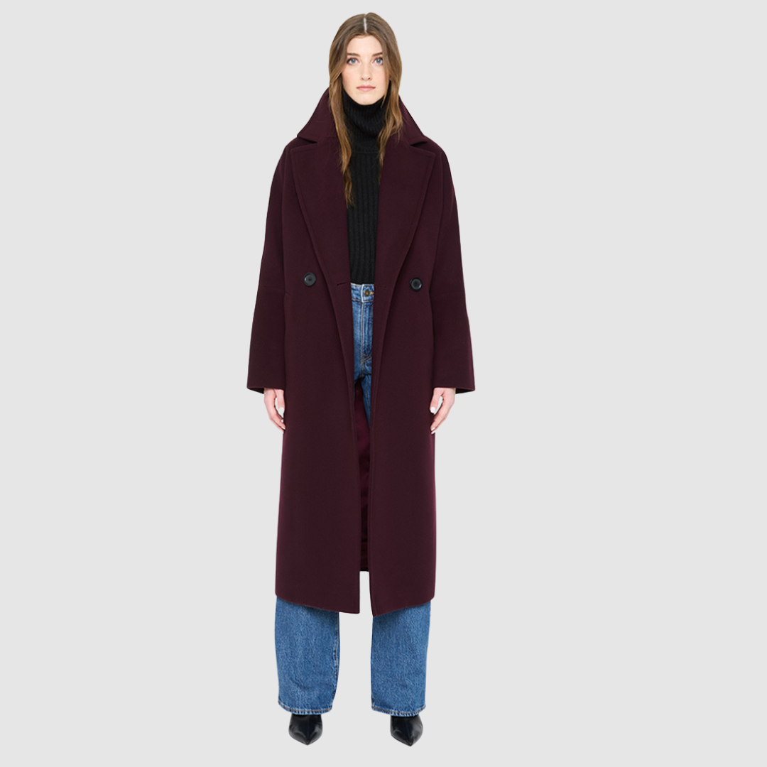 The HARPER Coat is a luxury oversized wool coat crafted from a premium Italian wool-cashmere blend in a rich  tone. Designed with a double-breasted front, drop shoulders, and an oversized fit through the shoulders, arms, and torso, it delivers both comfort and modern edge. A large notch collar and back vent add tailored refinement, while single welt pockets provide everyday functionality. HARPER is the ultimate women’s statement wool coat that blends timeless tailoring with contemporary proportions.