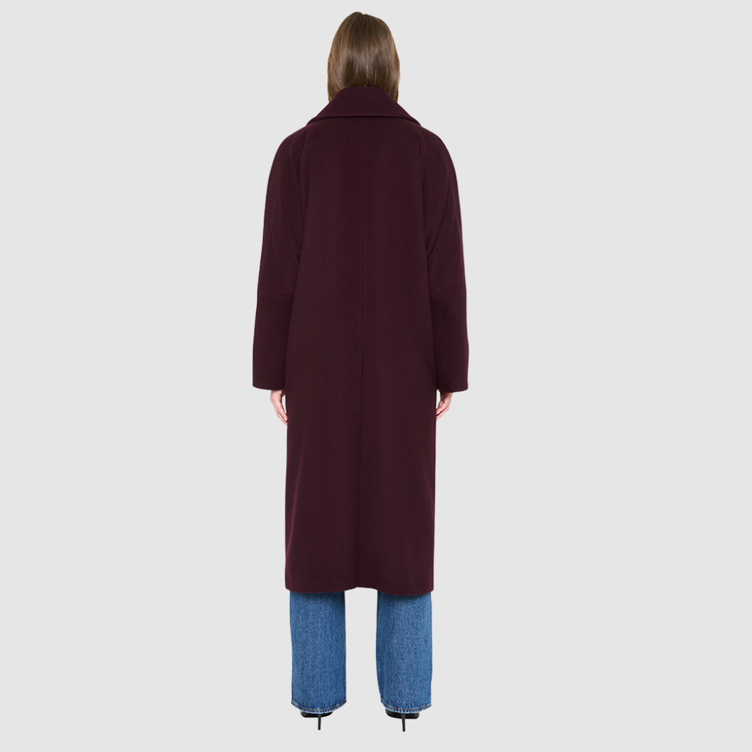 The HARPER Coat is a luxury oversized wool coat crafted from a premium Italian wool-cashmere blend in a rich  tone. Designed with a double-breasted front, drop shoulders, and an oversized fit through the shoulders, arms, and torso, it delivers both comfort and modern edge. A large notch collar and back vent add tailored refinement, while single welt pockets provide everyday functionality. HARPER is the ultimate women’s statement wool coat that blends timeless tailoring with contemporary proportions.