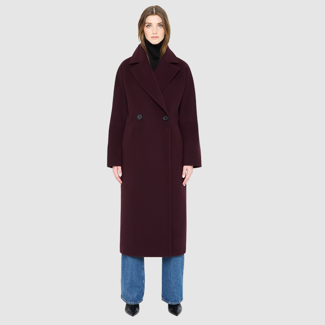 The HARPER Coat is a luxury oversized wool coat crafted from a premium Italian wool-cashmere blend in a rich  tone. Designed with a double-breasted front, drop shoulders, and an oversized fit through the shoulders, arms, and torso, it delivers both comfort and modern edge. A large notch collar and back vent add tailored refinement, while single welt pockets provide everyday functionality. HARPER is the ultimate women’s statement wool coat that blends timeless tailoring with contemporary proportions.