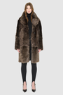 The JOY Jacket is a heritage-inspired reversible outerwear piece crafted in carbon suede shearling. Designed to flip seamlessly from plush oversized teddy to sleek suede, it offers versatile styling for both après-ski sophistication and everyday winter elegance. With a drop shoulder, large notch collar, and oversized silhouette, JOY combines comfort with modern edge. Functional slash side pockets on the teddy side and single welt pockets on the suede side, along with a front button closure, complete this lu