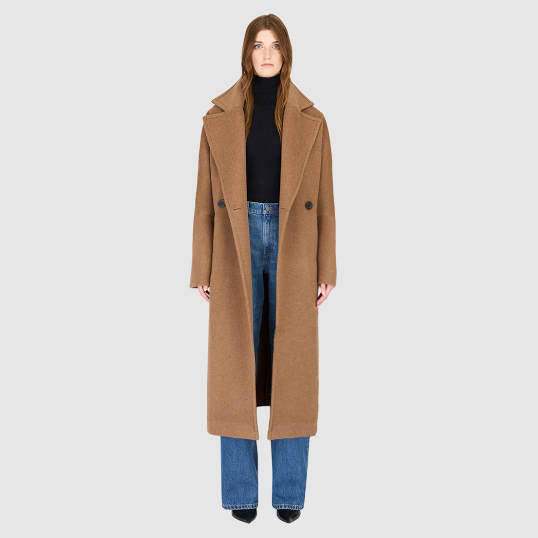 The HARPER Coat is a luxury oversized wool coat crafted from a premium Italian wool-cashmere blend in a rich came tone. Designed with a double-breasted front, drop shoulders, and an oversized fit through the shoulders, arms, and torso, it delivers both comfort and modern edge. A large notch collar and back vent add tailored refinement, while single welt pockets provide everyday functionality. HARPER is the ultimate women’s statement wool coat that blends timeless tailoring with contemporary proportions.