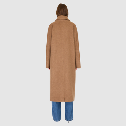 The HARPER Coat is a luxury oversized wool coat crafted from a premium Italian wool-cashmere blend in a rich came tone. Designed with a double-breasted front, drop shoulders, and an oversized fit through the shoulders, arms, and torso, it delivers both comfort and modern edge. A large notch collar and back vent add tailored refinement, while single welt pockets provide everyday functionality. HARPER is the ultimate women’s statement wool coat that blends timeless tailoring with contemporary proportions.
